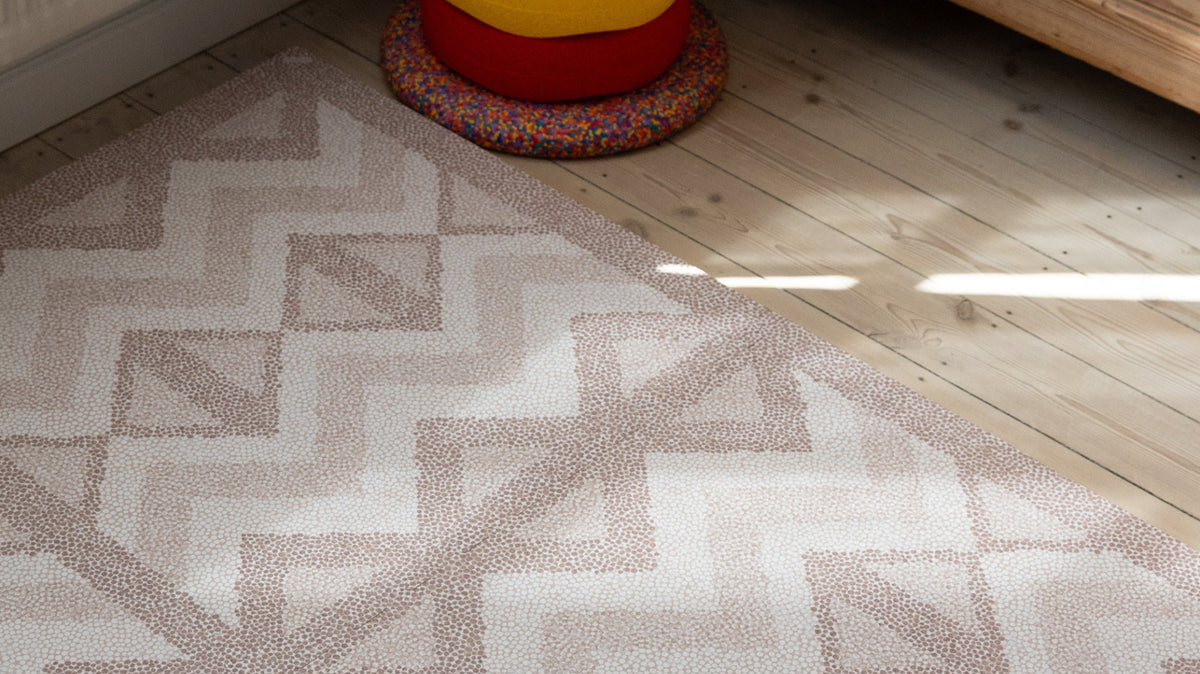 Kilim Soft Clay foam play mat on a wooden floor in a toddler room