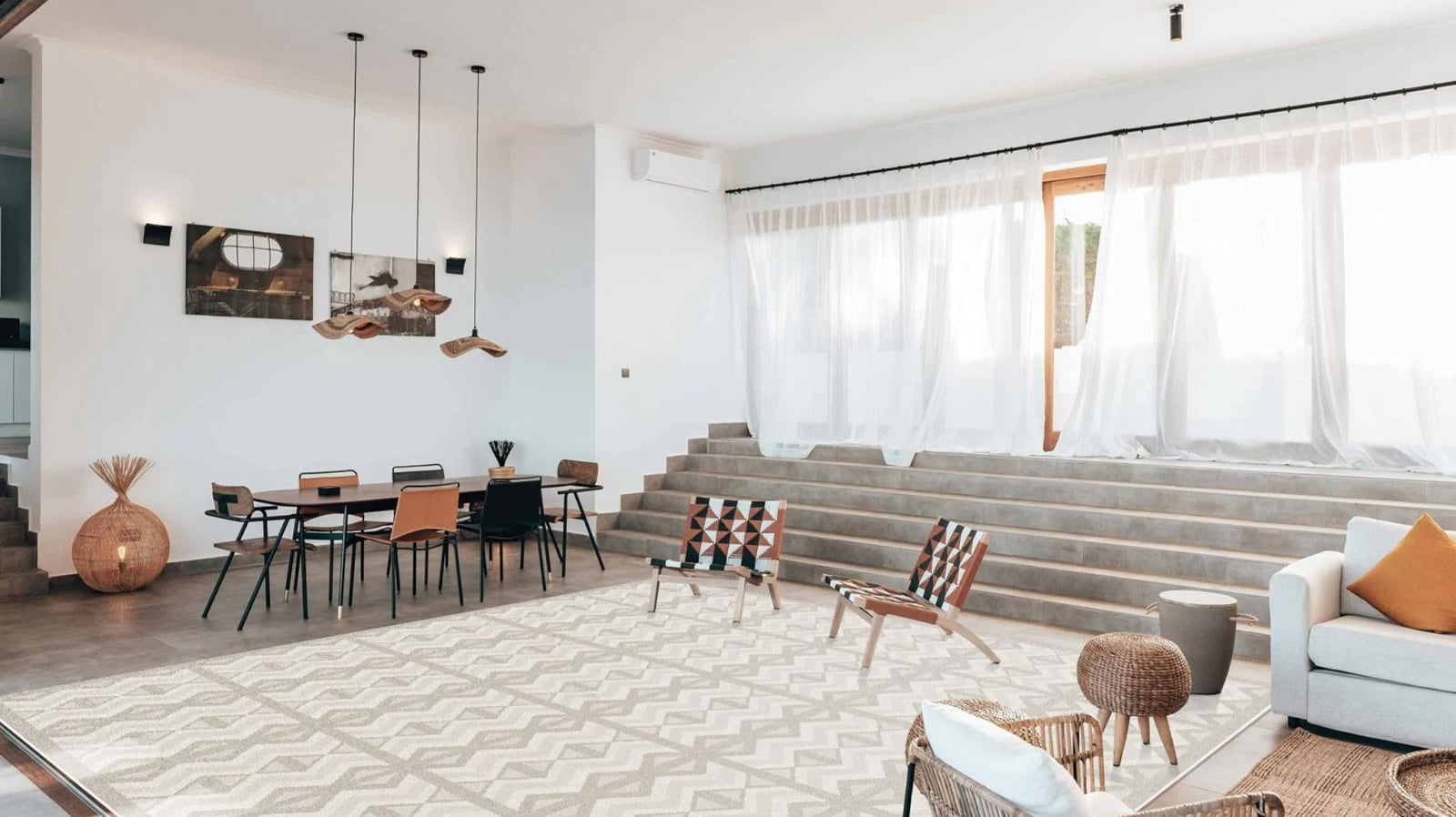 Large Eeveve Kilim Sand play mat in a spacious, luxury living room filled with natural daylight.