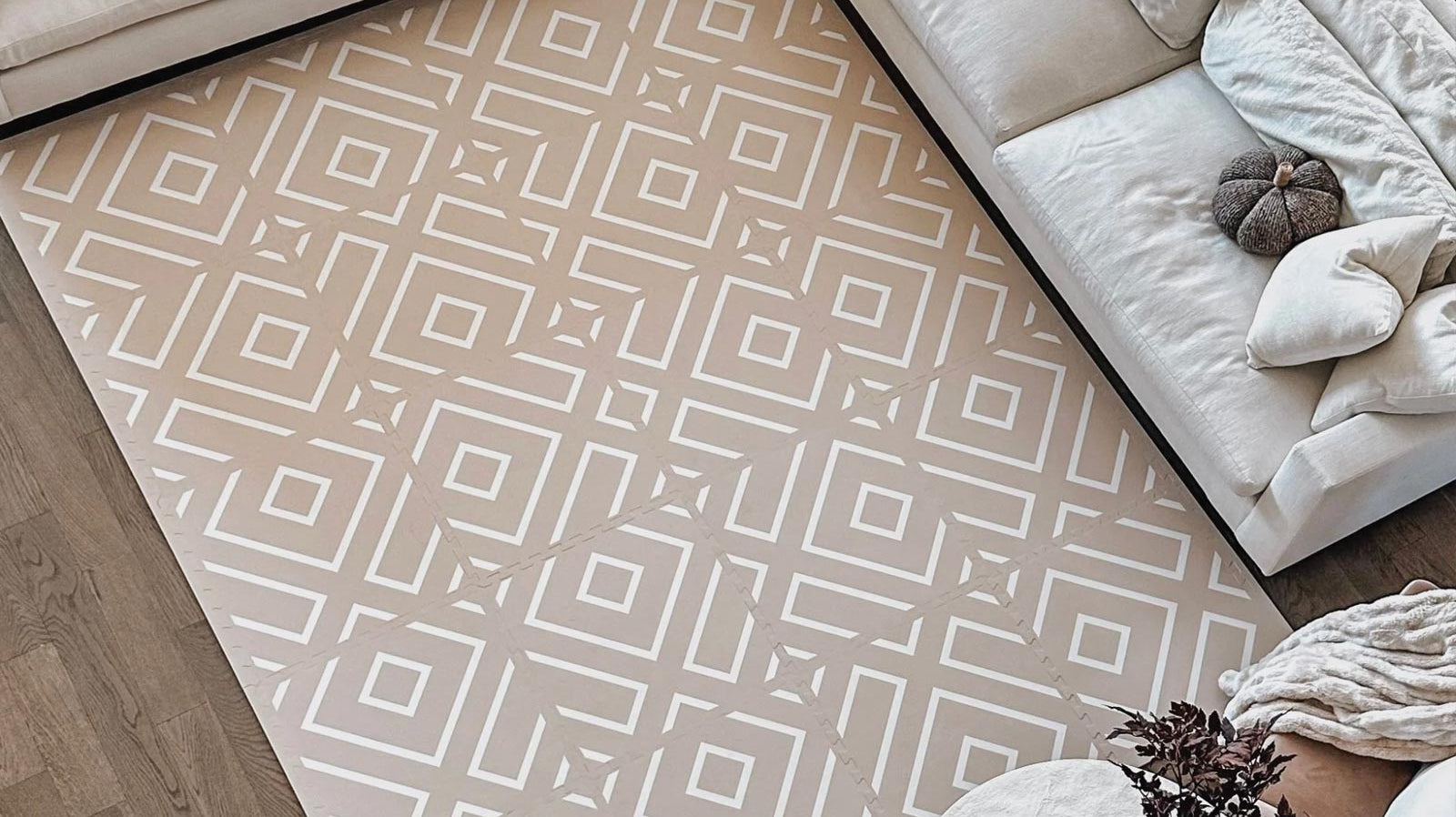 Large Eeveve Modern Blocks Desert Sand play mat used as a carpet in a bright living room.