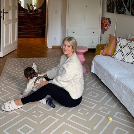 Mother and baby enjoying tummy time on the Modern Blocks Play Mat. Soft, safe, and stylish EVA foam mat enhances bonding and play sessions.