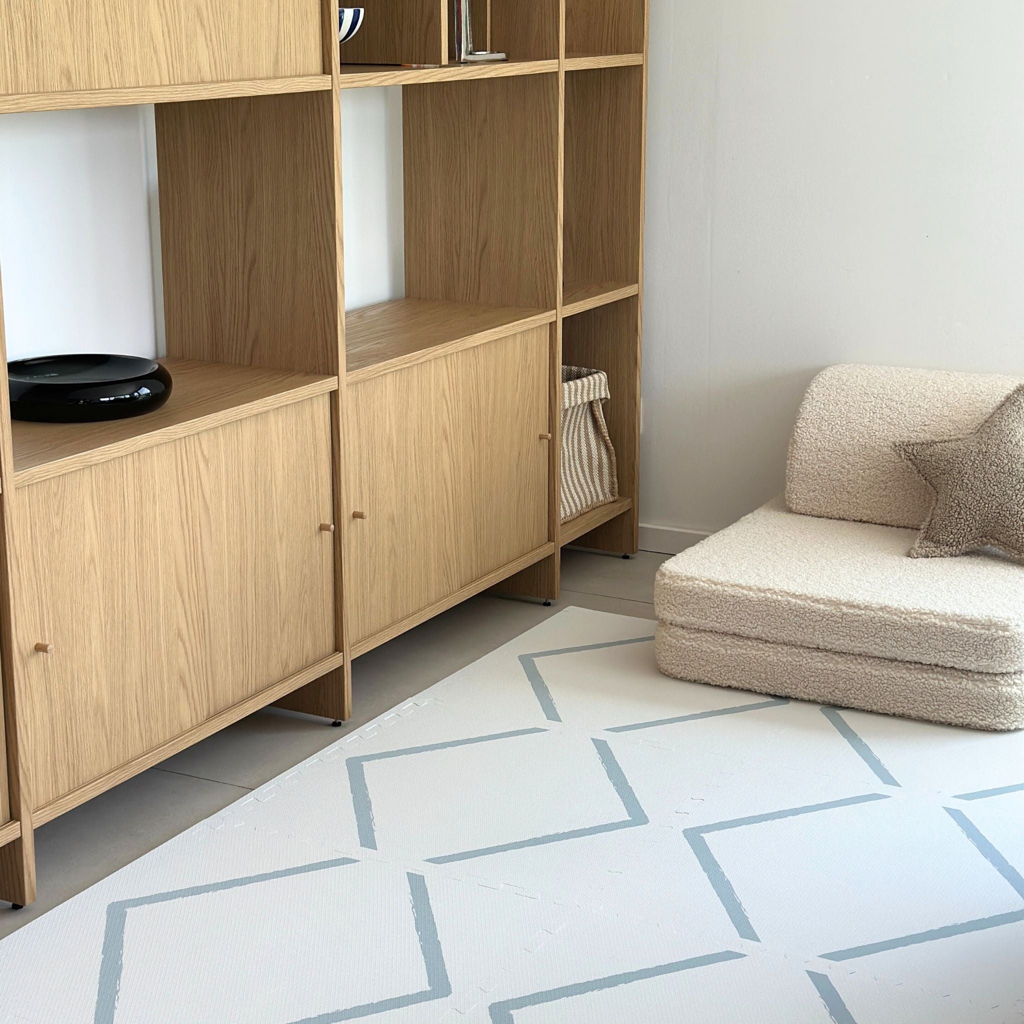 Beni Powder Blue play mat in a minimalist living space, blending seamlessly with modern decor while providing a safe play area for kids.