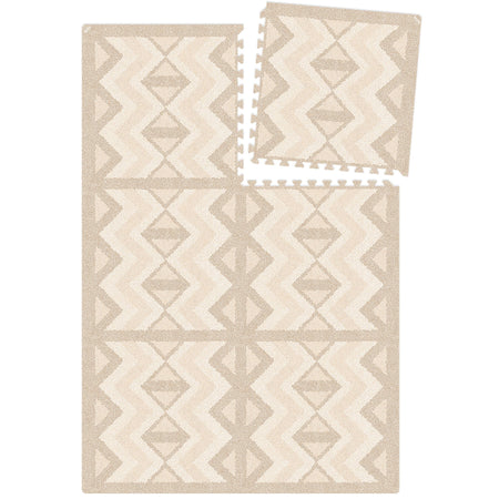 Top view of Kilim Sand Play Mat layout with one tile removed. Modular EVA foam mat with interlocking pieces for customizable size.
