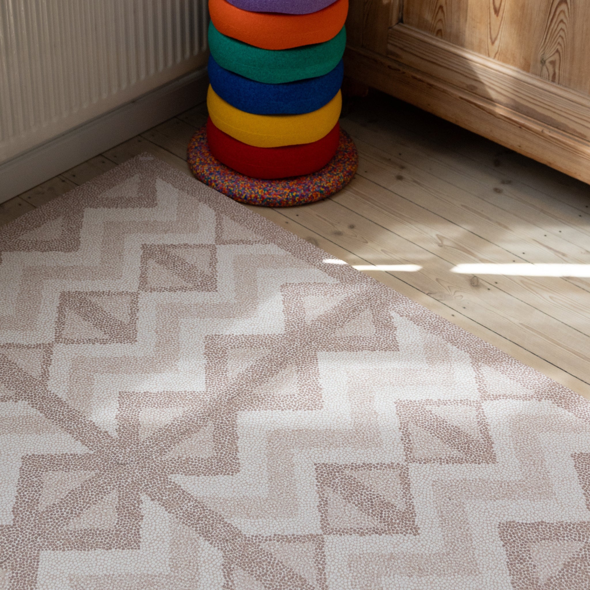 Kilim Soft Clay foam play mat on a wooden floor in a toddler room
