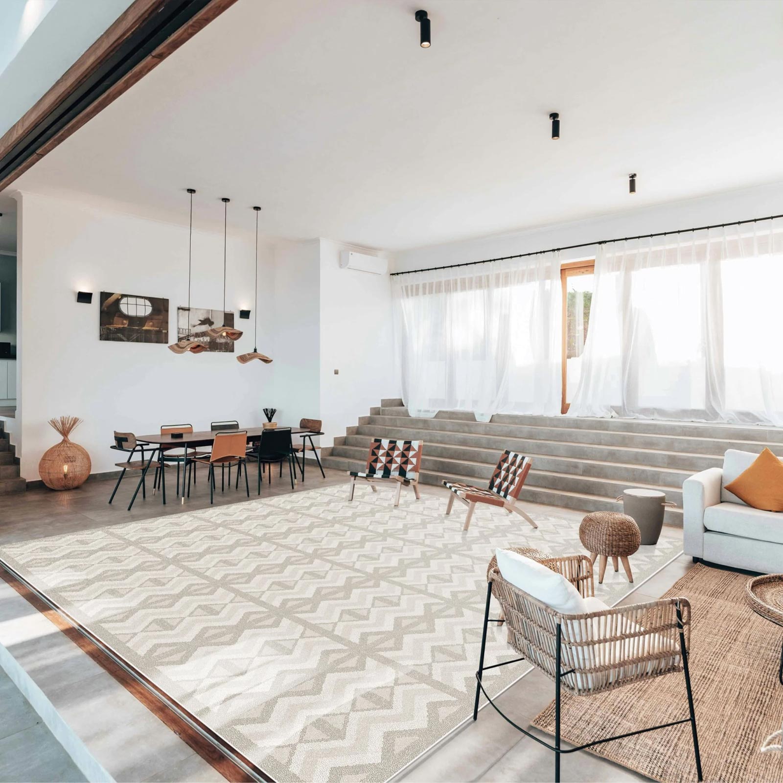 Large Eeveve Kilim Sand play mat in a spacious, luxury living room filled with natural daylight.