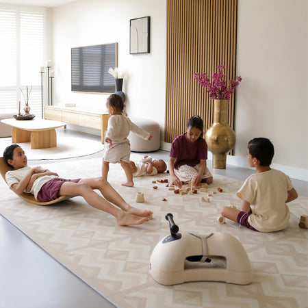 Children playing on Kilim Sand Play Mat in a modern living room. Spacious, stylish, and safe EVA foam mat for toddlers and kids.